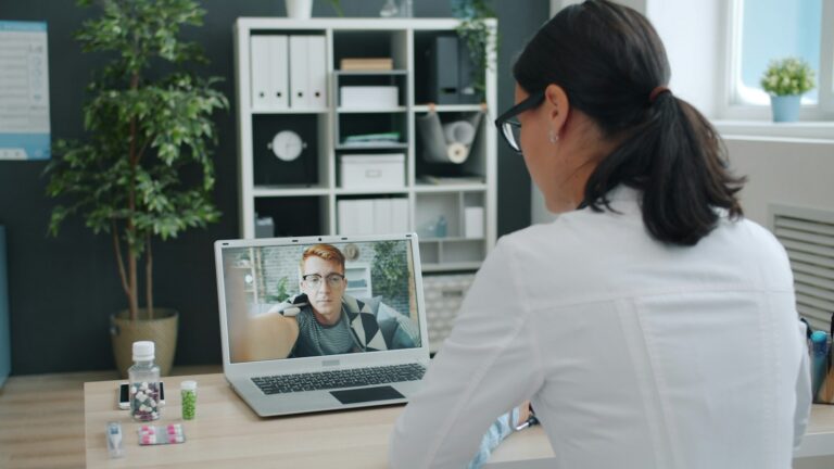 Provider reviewing GLP-1 eligibility with a patient over a telehealth video call